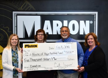Marion donates to the House of Hope Building Fund